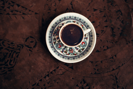 Turkish coffee with traditional cup top viewの写真素材