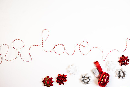 Word love made of red ribbon, on white backgroundの写真素材