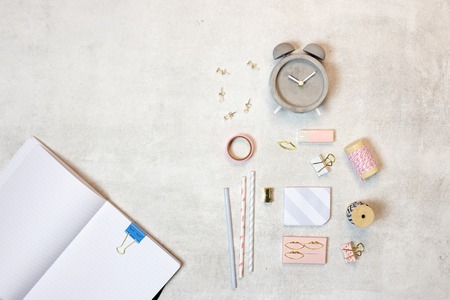 Over head view of flat lay pink and gold glamorous work space template grey backgroundの写真素材