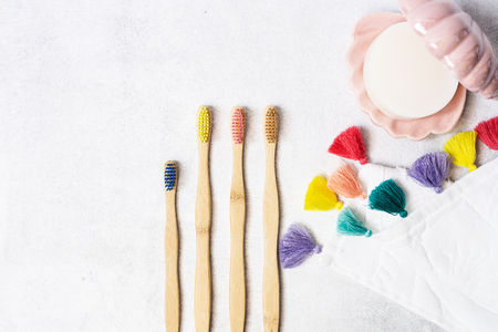 A family set of wooden bamboo toothbrushes on white backgroundの写真素材