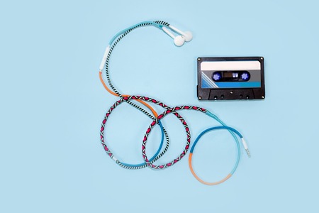 Top view retro tape cassette with colourful earphone. Love music conceptの写真素材