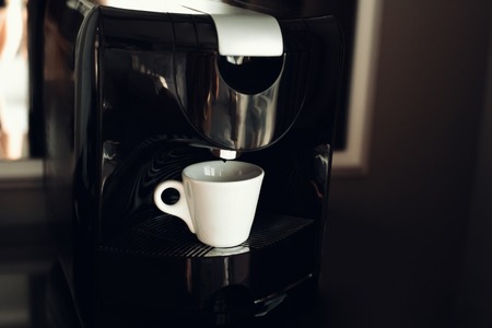 An espresso machine and a cupの写真素材