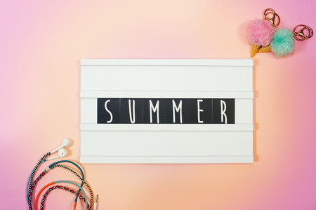 Tropical beach accessories top view with light box with text vacation mood onの写真素材