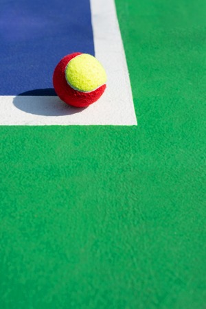 A tennis ball on the lineの写真素材