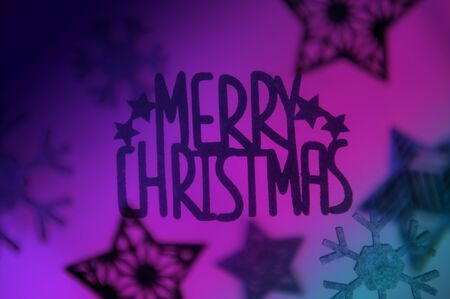 Merry Christmas message with hanging star ornamentsの写真素材