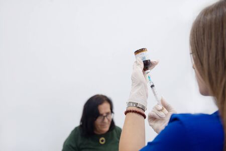 Glass vial of lidocaine injection solution with on white background.のeditorial素材