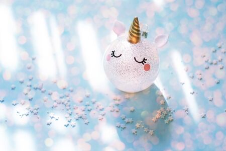 Pink glitter unicorn with gold horn Christmas tree ornament.Magic surreal style.の写真素材