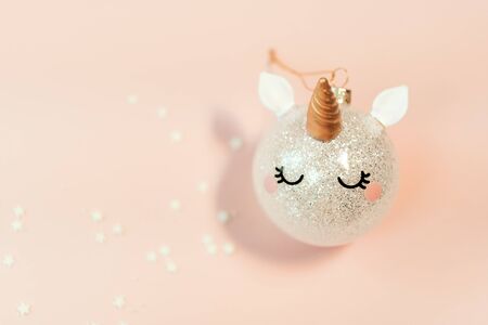 Pink glitter unicorn with gold horn Christmas tree ornament.Magic surreal style.の写真素材