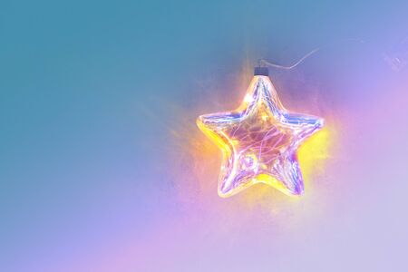 Christmas bauble star decoration vivid neon colors. Christmas background conceptの写真素材