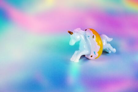 Unicorn horse jumping through a donutの写真素材