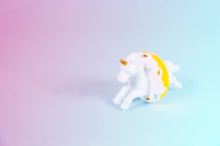 Unicorn horse jumping through a donutの写真素材