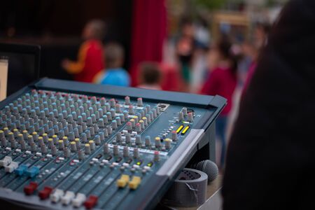 A girl is taking pictures of a street concert on the phoneのeditorial素材