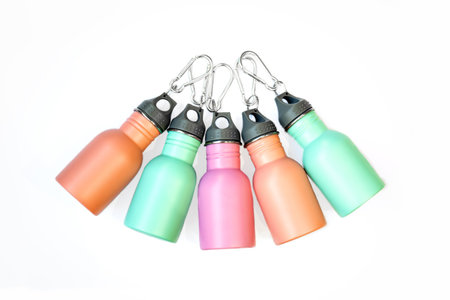 A set of safe, reusable stainless steel water bottles isolated white background