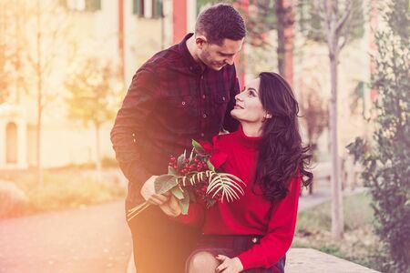 Lovely couple in love a tender embrace enjoy each other in warm sunny lightの写真素材