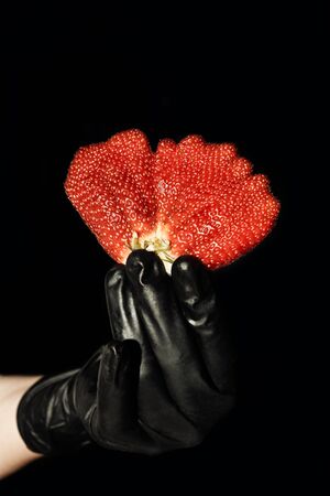 Abnormal strawberry shape in a handの写真素材