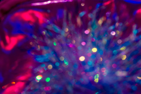 Vibrant holographic glowing rainbow colors neon bokeh background. Seasonal light decorative abstract...