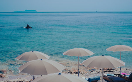 Tranquil view to Dhermi beach turquoise water and umbrellas Albaniaの写真素材