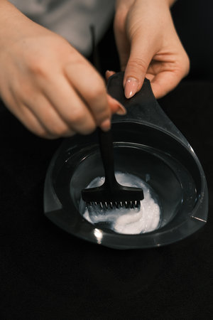 Close up to hands working on hair treatmentの写真素材