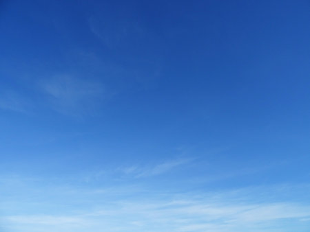Translucent clouds in a blue sky, cirrus clouds on a sunny dayの写真素材