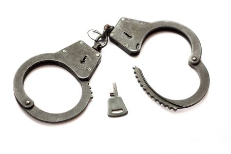 handcuffs isolated in whiteの写真素材