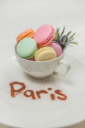 sweet french macaroon on white isolated white background. fly falling sweet macaroniの写真素材