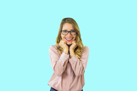 Girl smiling with perfect smile and white teeth on an isolated background and looking at camera