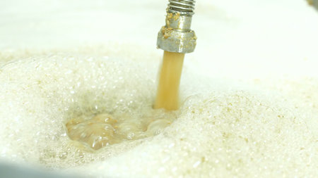 cooking barley grains for producing beer at the brewery