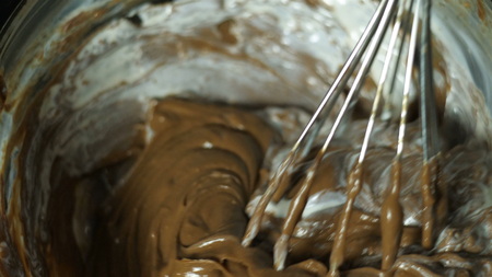 Abstract background, hot, melted chocolate and milk mixing pattern or ice cream.の写真素材