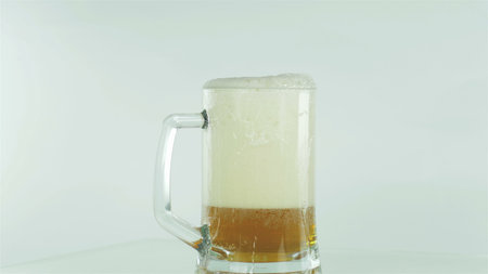 Glass of beer on a white background.