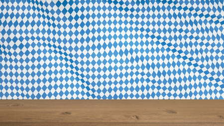 OKTOBERFEST Blue Geometric Pattern flag. Germany's Oktoberfest world's biggest Beer Festival. Oktoberfest and Bavarian flag pattern with wooden table.の写真素材