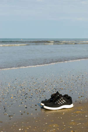 Sports footwear on seacoastの写真素材