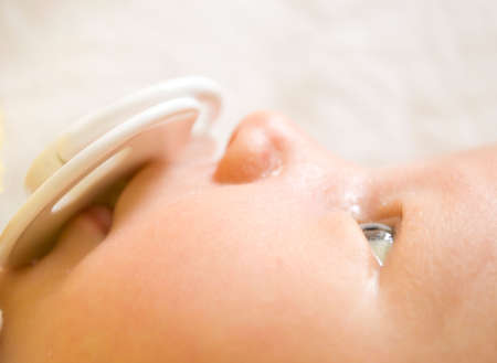 The child with a baby's dummyの写真素材