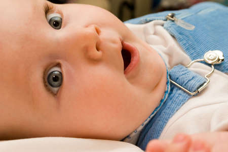 The surprised child with the big eyesの写真素材