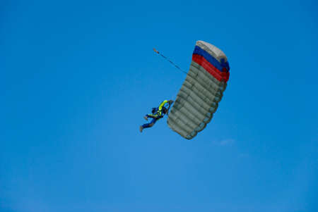 The parachutist against the blue skyの写真素材
