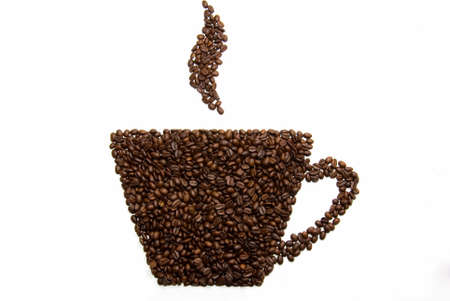 Silhouette of a cup from coffee grains on a white backgroundの写真素材