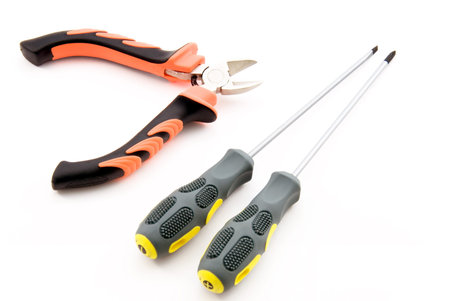 Screwdrivers and cutter isolated on white background