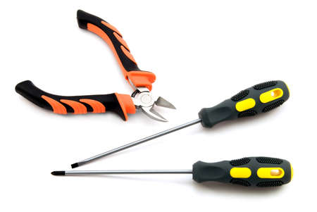 Screwdrivers and cutter isolated on white backgroundの写真素材