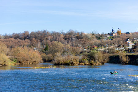 In the distance the fisher catches fish on the river