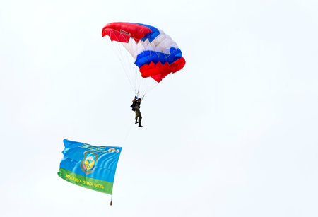 Alabino, Moskow region, Russia - July 29, 2017: Russian paratroopers demobilized with a flag walking...