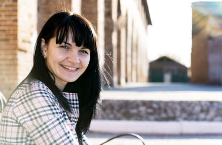 Outdoors portrait of beautiful young brunette girl.の写真素材