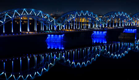 Railway bridge over the Daugava river at night, Latviaの写真素材