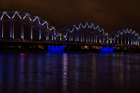 Railway bridge at night in Riga, Latvia