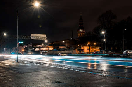 Long exposure photo at night. Light trails on the roadの写真素材