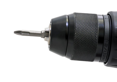Cordless drill with drill bit working also as screw gun. Isolated on whiteの写真素材