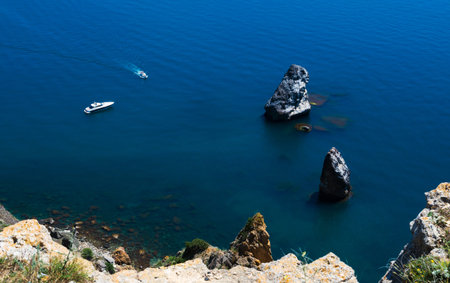 Amazing view to Yacht sailing in open sea at calm day. Drone view - birds eye angle. Yachting theme.の写真素材