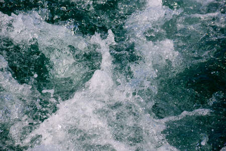 White crest of a sea wave. Selective focus. Shallow depth of field. Toned.の写真素材
