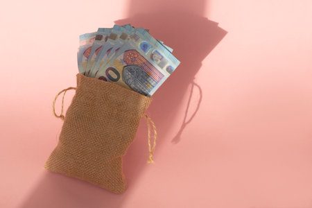 EURO money in bag from tissues on beige background.の写真素材
