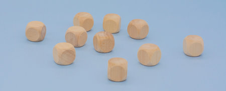 wooden cubes on a blue background. Business concept