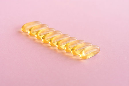 Fish oil capsules with omega 3 and vitamin D, healthy eating conceptの写真素材