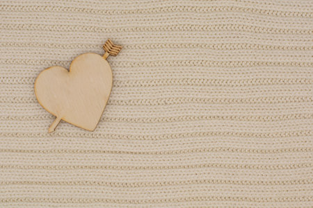 A wooden heart on a warm blanket. The concept of love. Valentine's dayの写真素材